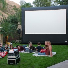 Outdoor cinema screen on the lawn
